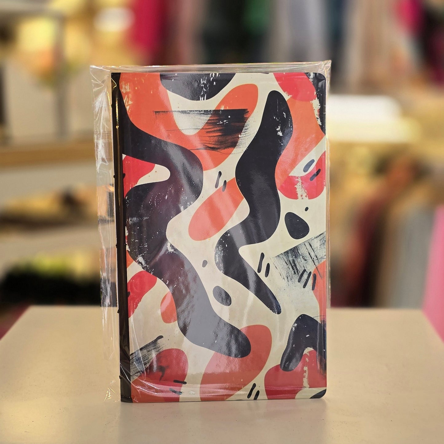 Libreta Delgada Manchas Naranja con Negro