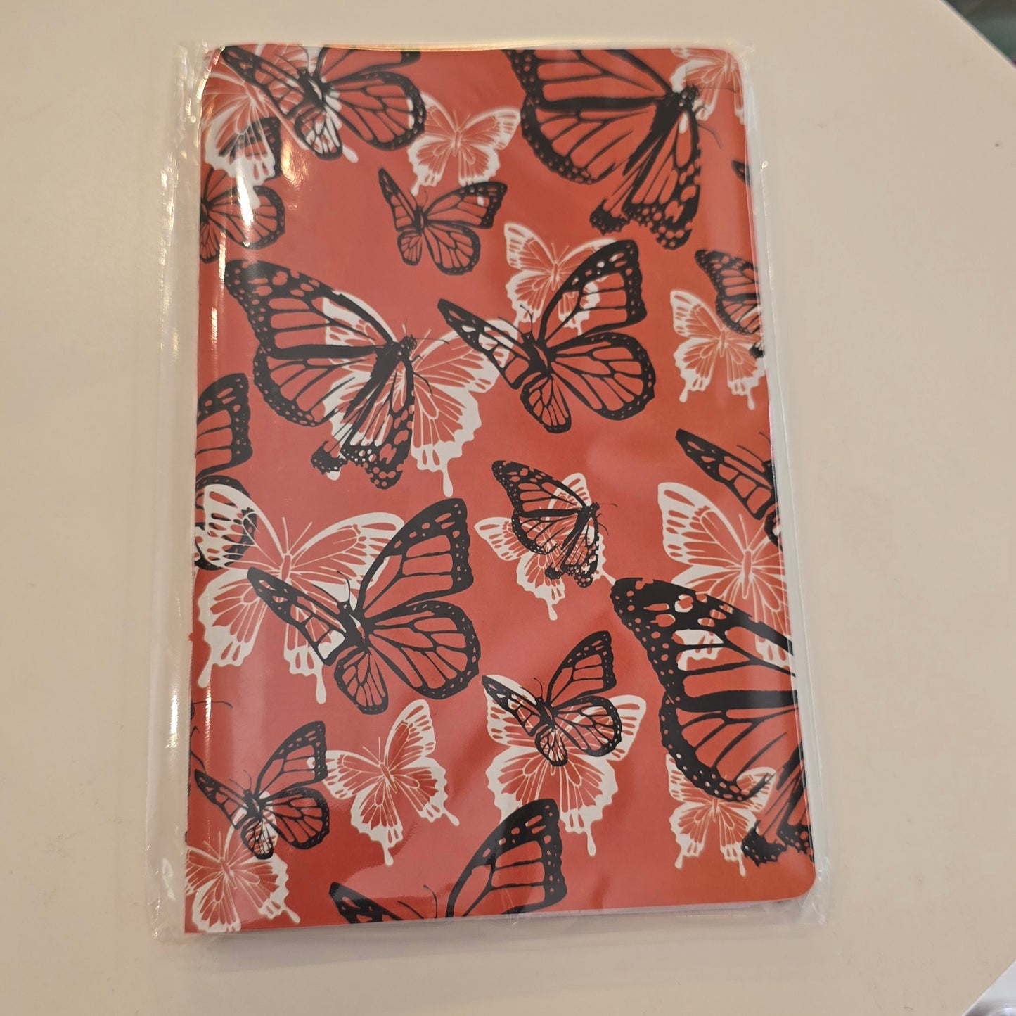 Libreta Delgada Naranja con Mariposas