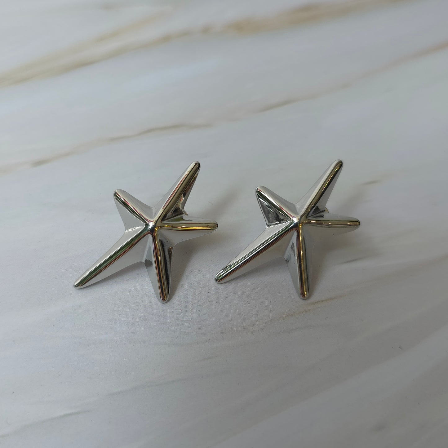 Aretes Estrellas Plateadas