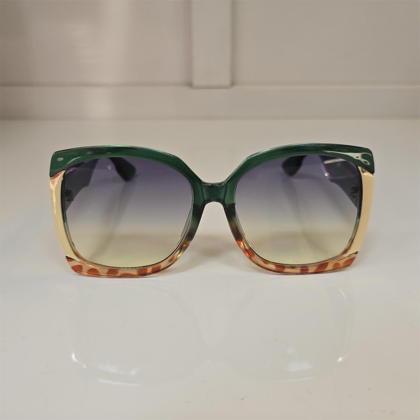 Lentes "Savanna" en verde, dorado y print sutil