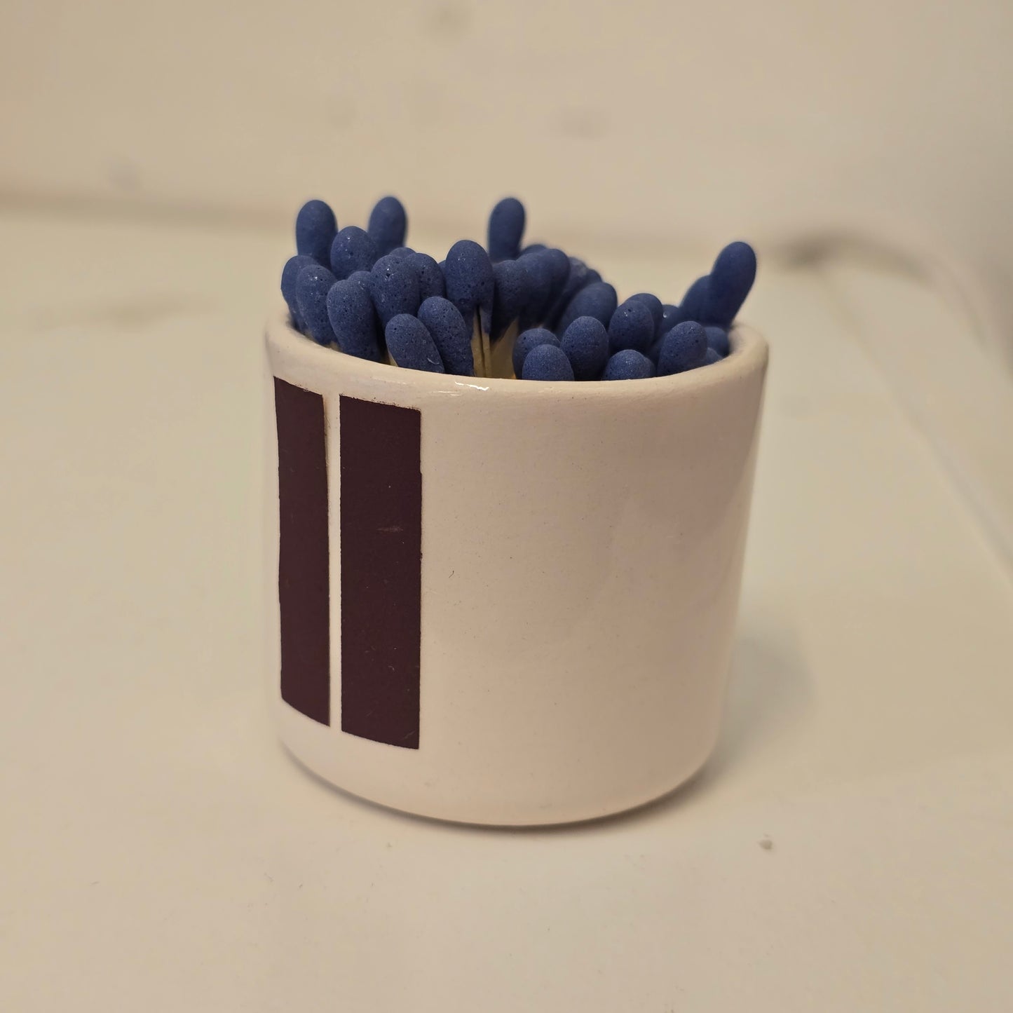 Cerillero de cerámica "Ojo que todo enciende"